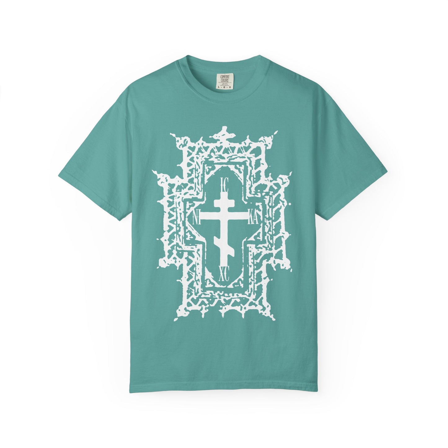 Seafoam heavyweight cotton unisex tee featuring a large, ornate white Orthodox cross in Gothic cathedral style—symbolizing Jesus Christ’s suffering, crowned with thorns, and representing the message “Healed By His Wounds”—centered on the front. Product name: ICXC NIKA | Jesus Christ Conquers.