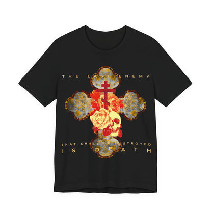 Remembrance of Death “The Final Enemy That Shall Be Destroyed Is Death (1 Cor 15:26)” Orthodox Christian T-shirt features a metallic gothic cross, skull, and rose design, inspired by 1 Corinthians 15:26 and themes of resurrection.
