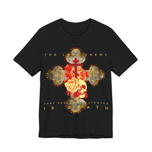 Remembrance of Death “The Final Enemy That Shall Be Destroyed Is Death (1 Cor 15:26)” Orthodox Christian T-shirt features a metallic gothic cross, skull, and rose design, inspired by 1 Corinthians 15:26 and themes of resurrection.