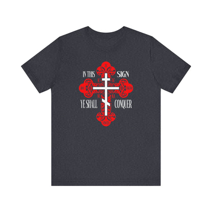 Heather navy unisex tee featuring an ornate Orthodox cross and the words "In This Sign Ye Shall Conquer" (In Hoc Signo Vinces)—a striking statement for those devoted to faith and victory in Christ.