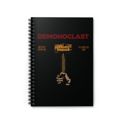 Black spiral notebook featuring "Demonoclast | St. Marina's Hammer | NIKA Fist | Christ Conquers | Demon Smasher | Unseen Warfare | Christian Martyrdom" design with a hand holding a golden hammer, inspired by the Life of St. Marina.