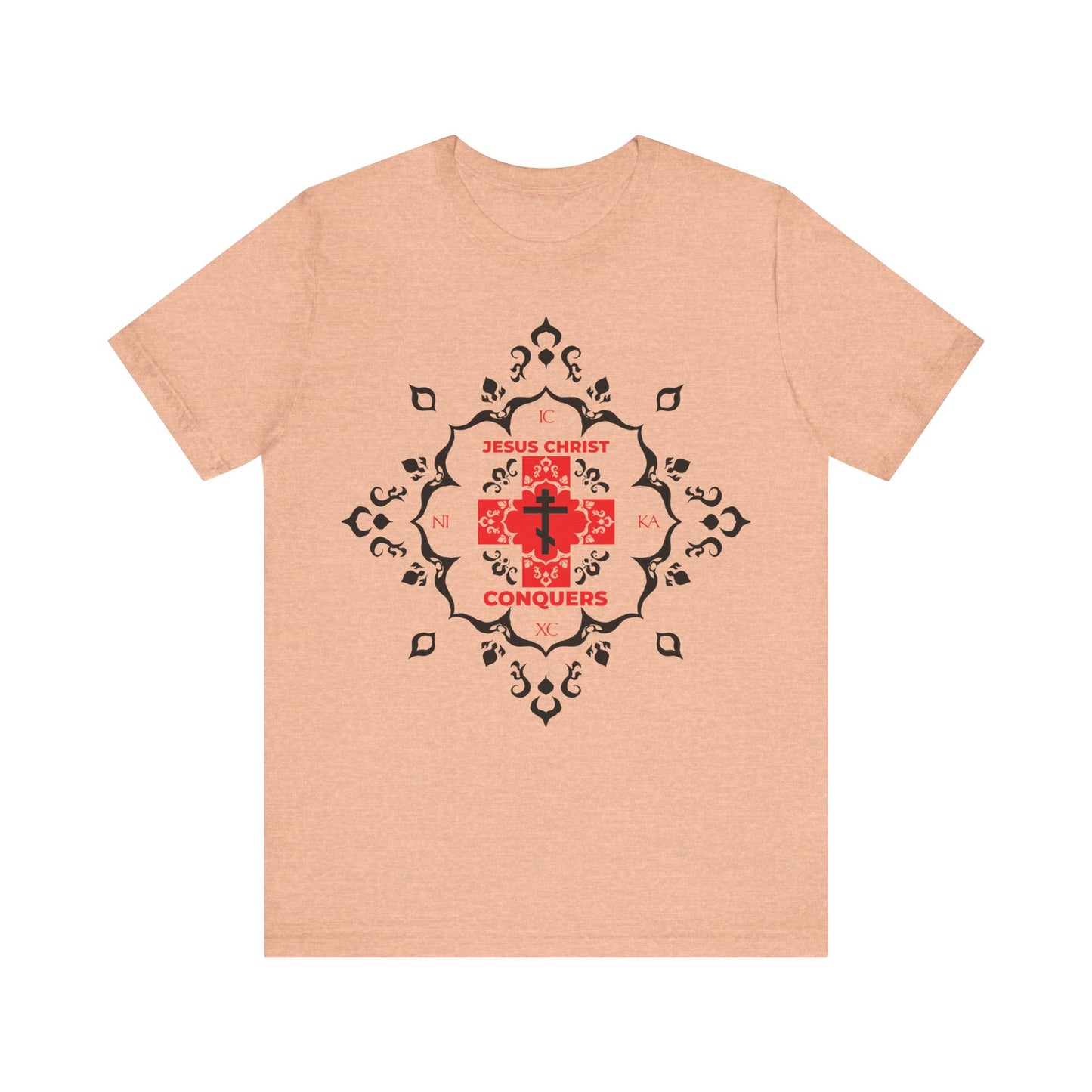 Heather peach t-shirt featuring a white Orthodox cross with "ICXC NIKA" in red modern font and medieval filigree, symbolizing Jesus Christ's victory—echoing St. John Chrysostom. 100% cotton Christian tee.