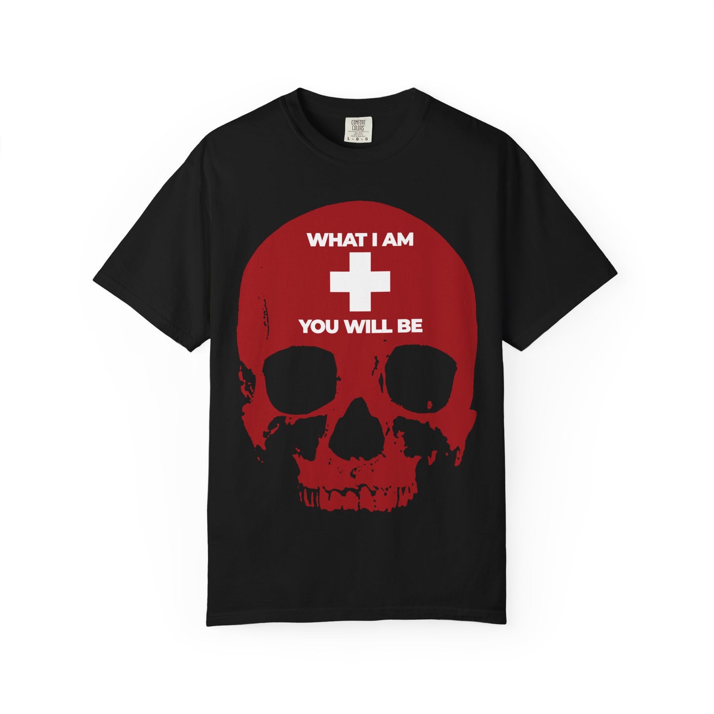 Clad in black, this heavyweight cotton unisex tee—titled “What I Am You Will Be White Cross on Red Skull”—features a striking red skull, overlaid with a white cross and the message “WHAT I AM YOU WILL BE” above and below, evoking the Orthodox Christian tradition of *memento mori* and recalling Ecclesiastes’ timeless wisdom.