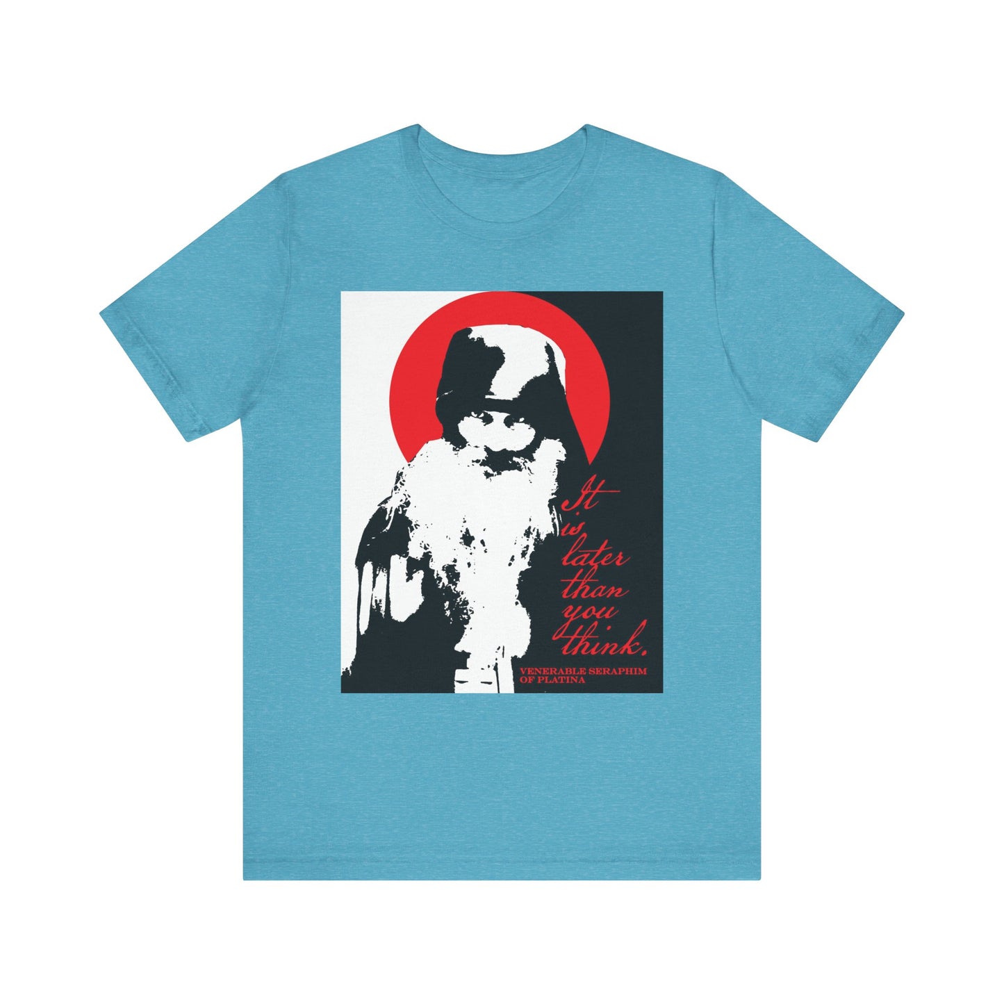 Heather aqua t-shirt featuring a bearded figure inspired by Fr Seraphim Rose and Orthodox spiritual life, set against a bold red circle background with striking red text: It is later than you think. Lightweight cotton unisex style in black, white, and red high contrast.