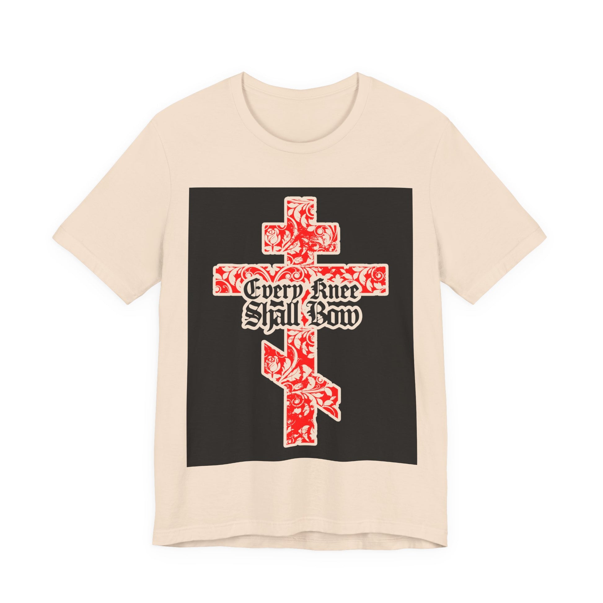 Beige unisex tee featuring a gold and red floral Orthodox cross with gothic lettering, inspired by Isaiah 45:22-24 and Philippians 2:7-11. "Every Knee Shall Bow" design for Christian style.