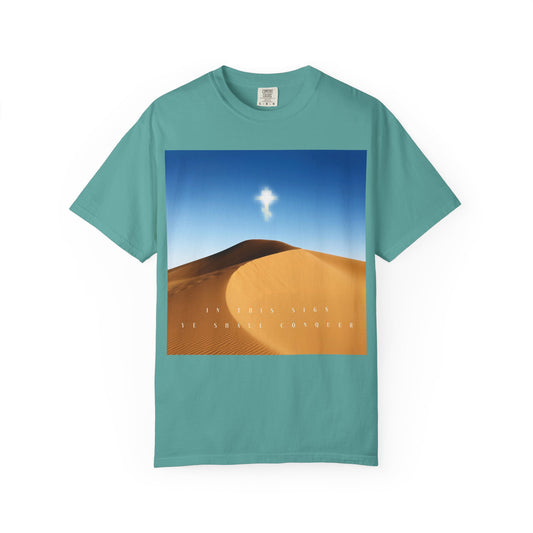 Seafoam heavyweight cotton unisex tee featuring a desert sun scene, a radiant cross representing the Elevation of the Cross, and the text: “IN THIS SIGN YE SHALL CONQUER.” Product name: In This Sign Ye Shall Conquer Desert Sun Scene | The Cross is the Might of Kings | Orthodox Christian Tee.