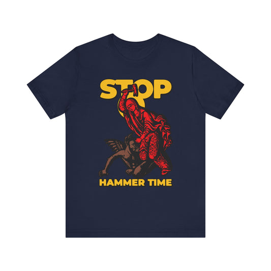 Navy t-shirt featuring St Marina of Antioch beating the devil with a hammer, a playful "Stop, Hammer Time" Orthodox meme design, inspired by saints' lives. Red, blue, and yellow print on lightweight cotton.