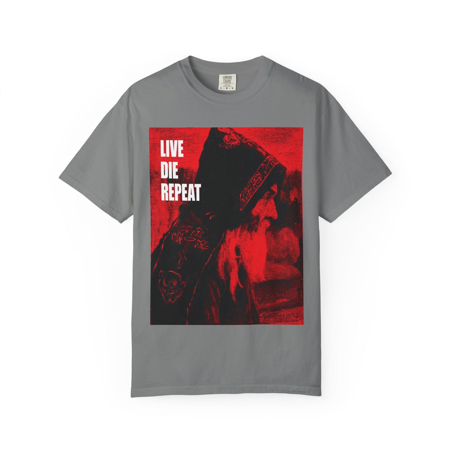 Grey heavyweight cotton unisex tee featuring Mikhail Nesterov’s Orthodox Monk art and the quote "Die Every Day, You Will Live Forever"—inspired by St Antony the Great. Graphic shows a hooded figure with "LIVE DIE REPEAT" text.