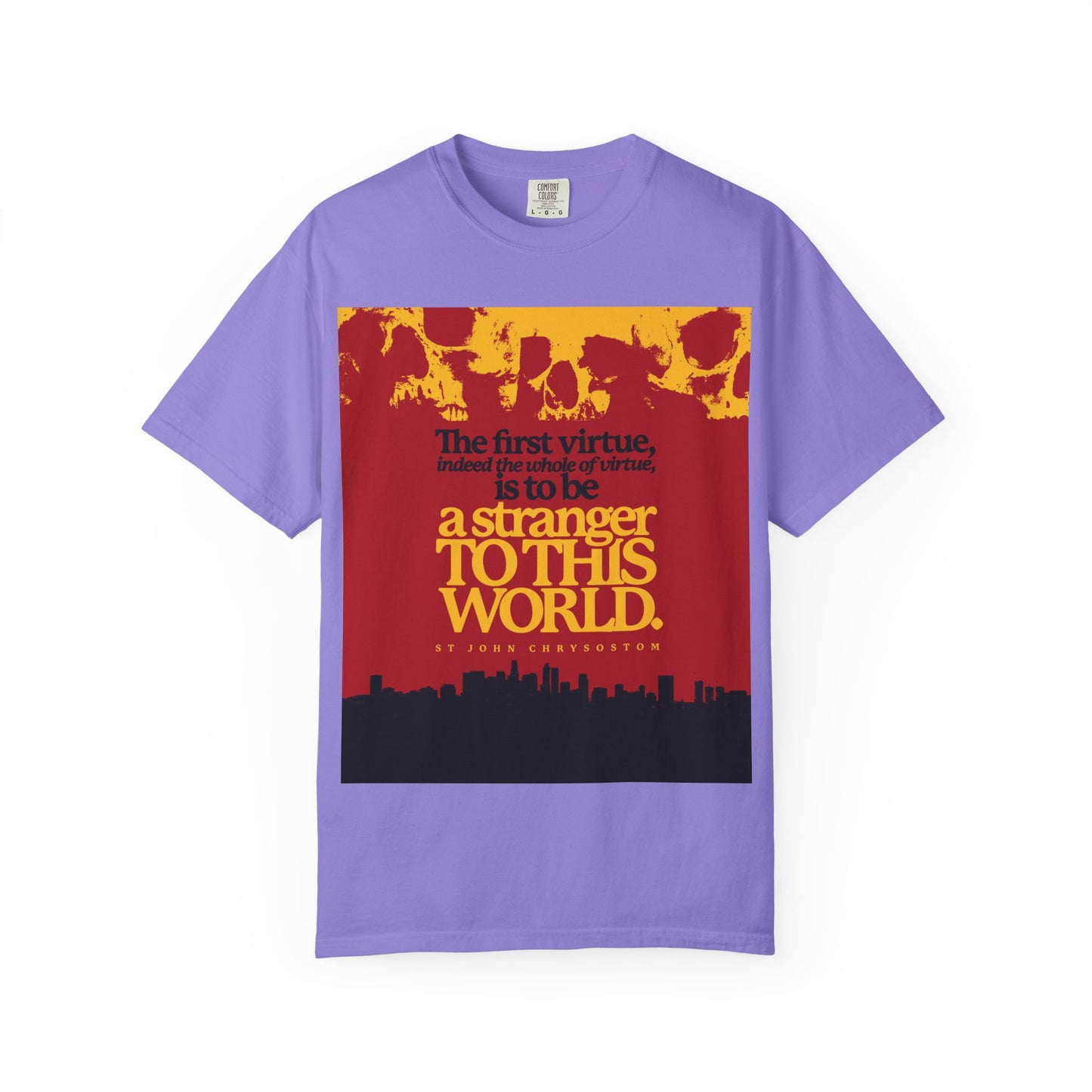 Violet heavyweight cotton unisex t-shirt featuring skulls and cityscape graphic with the text "All of Virtue is Be a Stranger To this World" (St John Chrysostom), inspired by Orthodox Christian themes.