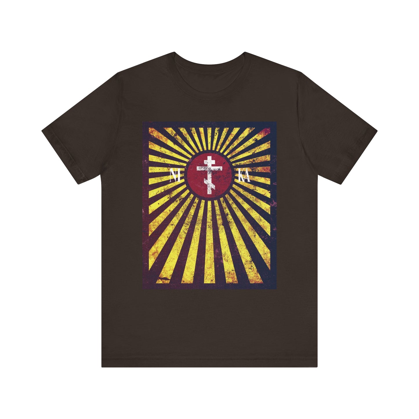 Brown t-shirt featuring the "NIKA Red Rising Sun Cross with Golden Rays" design, with a distressed textured flag graphic incorporating a white cross and Cyrillic letters—symbolizing the cross to bear and echoing the teachings of St Paisios of Mount Athos.