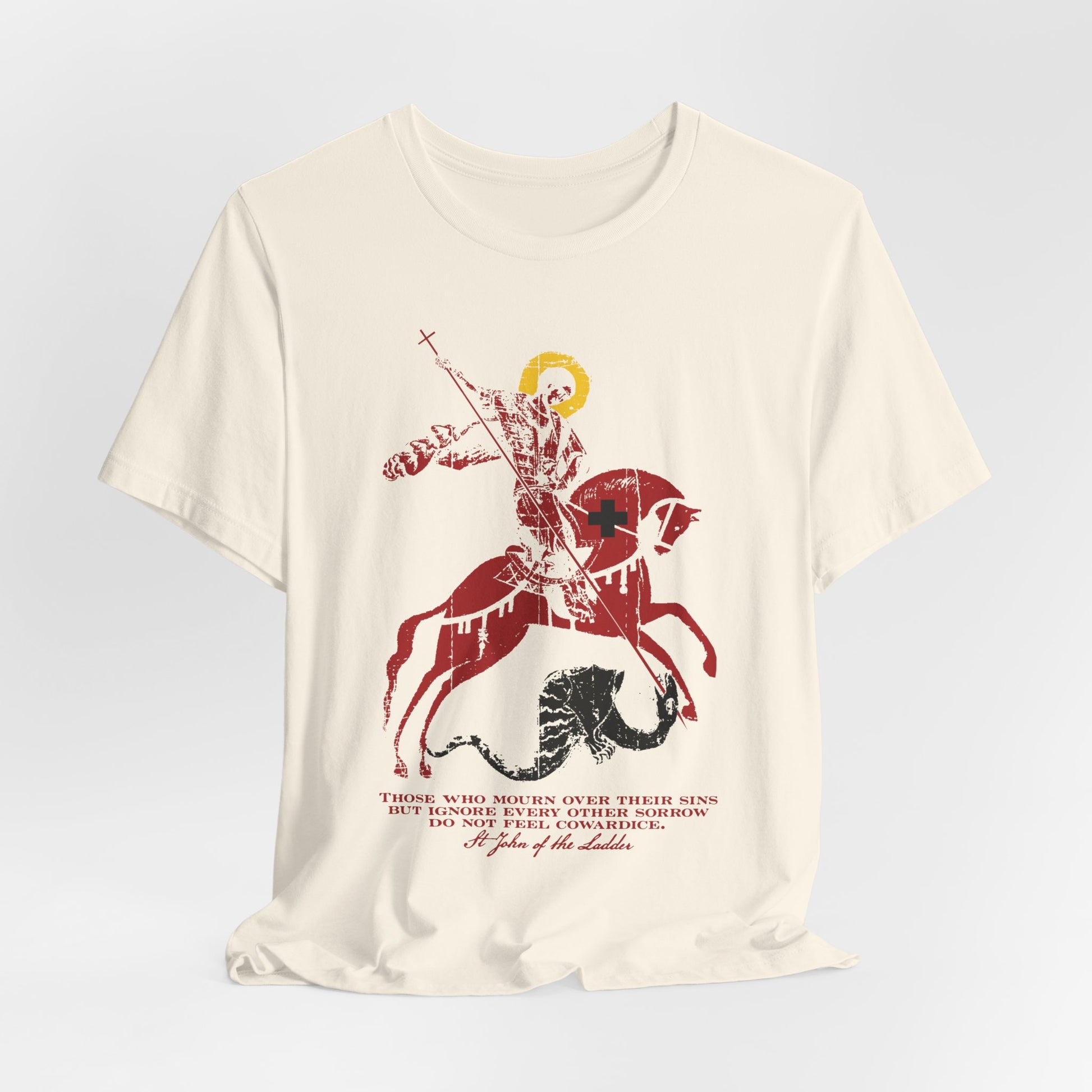 Those Who Mourn Over Their Sins | St George Slaying Dragon IconoGraphic | St John Climacus | Orthodox Christian Lightweight Cotton Unisex Tee features a cream color and a bold graphic of St. George riding a horse and slaying the dragon, with striking red and black text beneath the image—symbolizing the godly sorrow described by St John Climacus.