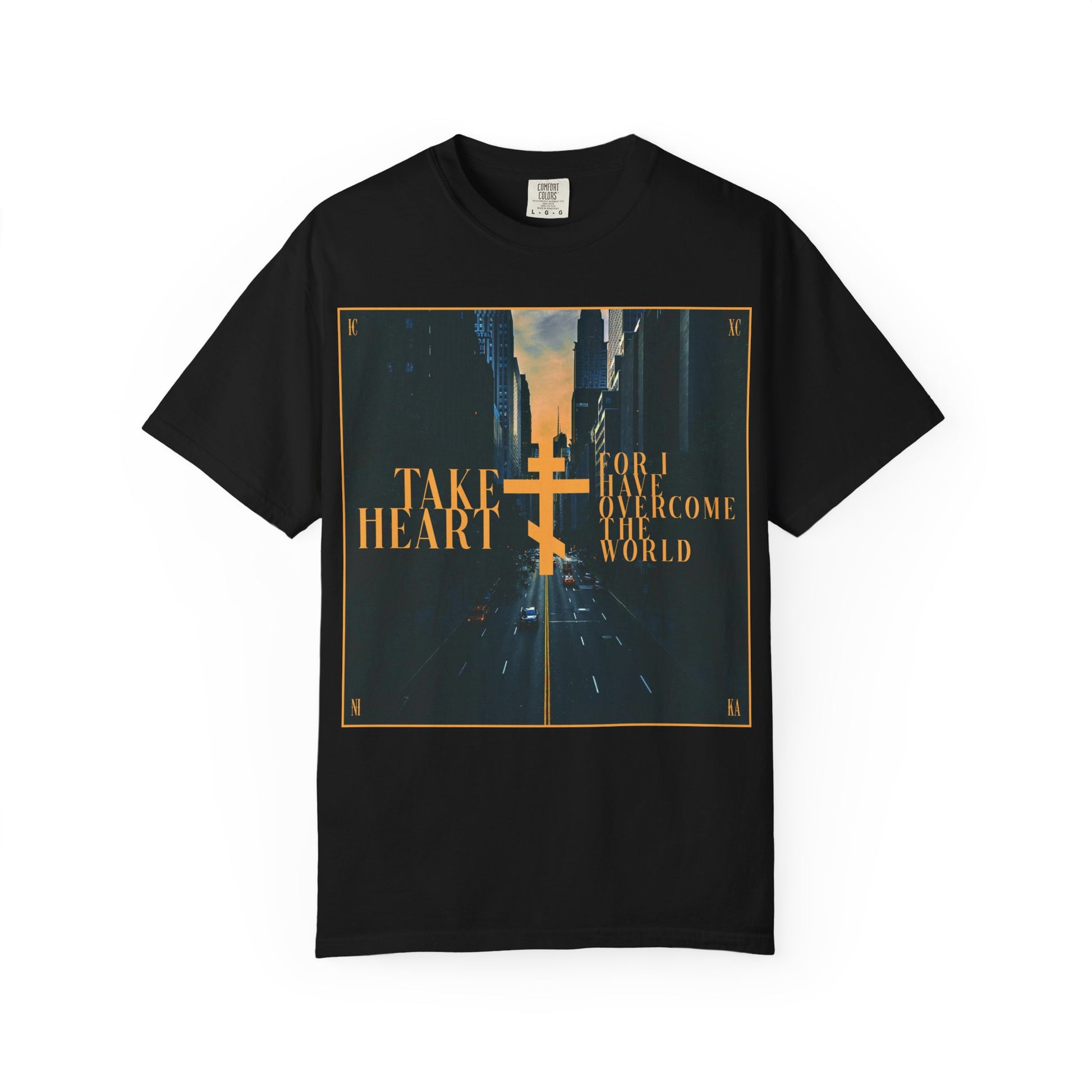 Black heavyweight cotton unisex tee featuring a modern city street scene and the gold-printed words "Take Heart, For I Have Overcome the World" (John 16:33)—a wearable reminder that though spoken in parables, your sorrow will turn to joy when you ask and receive.