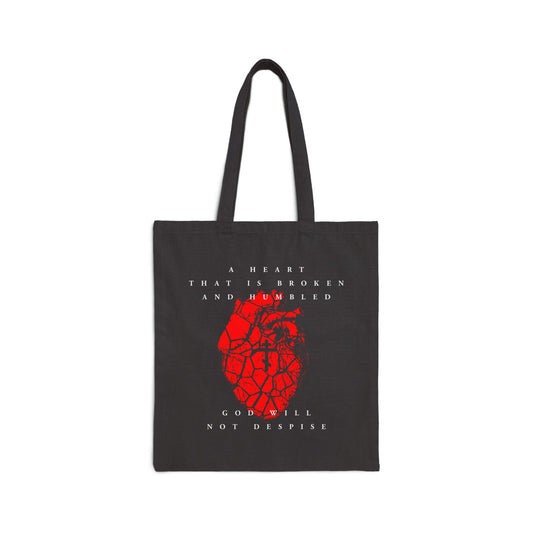 Black cotton tote bag featuring a cracked red heart with Orthodox cross and the text: “A heart that is broken and humbled God will not despise.” Inspired by Psalm 51. Perfect for Christian reflection and repentance.