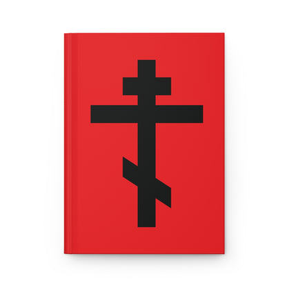 A red hardcover journal featuring a large black Orthodox cross and the quote "May I never boast, except in the cross of our Lord Jesus Christ" (Gal 6:14) on the cover.