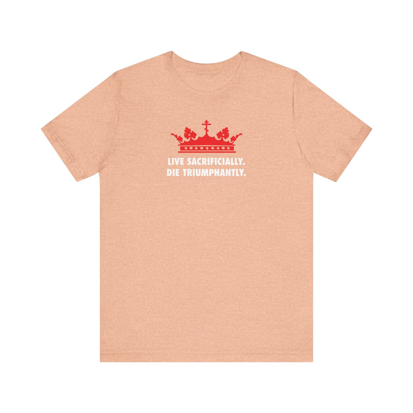 Heather peach unisex lightweight cotton t-shirt featuring a red crown graphic and white text: "Live Sacrificially, Die Triumphantly," inspired by St. Ignatius of Antioch’s message in his Epistle to the Romans.