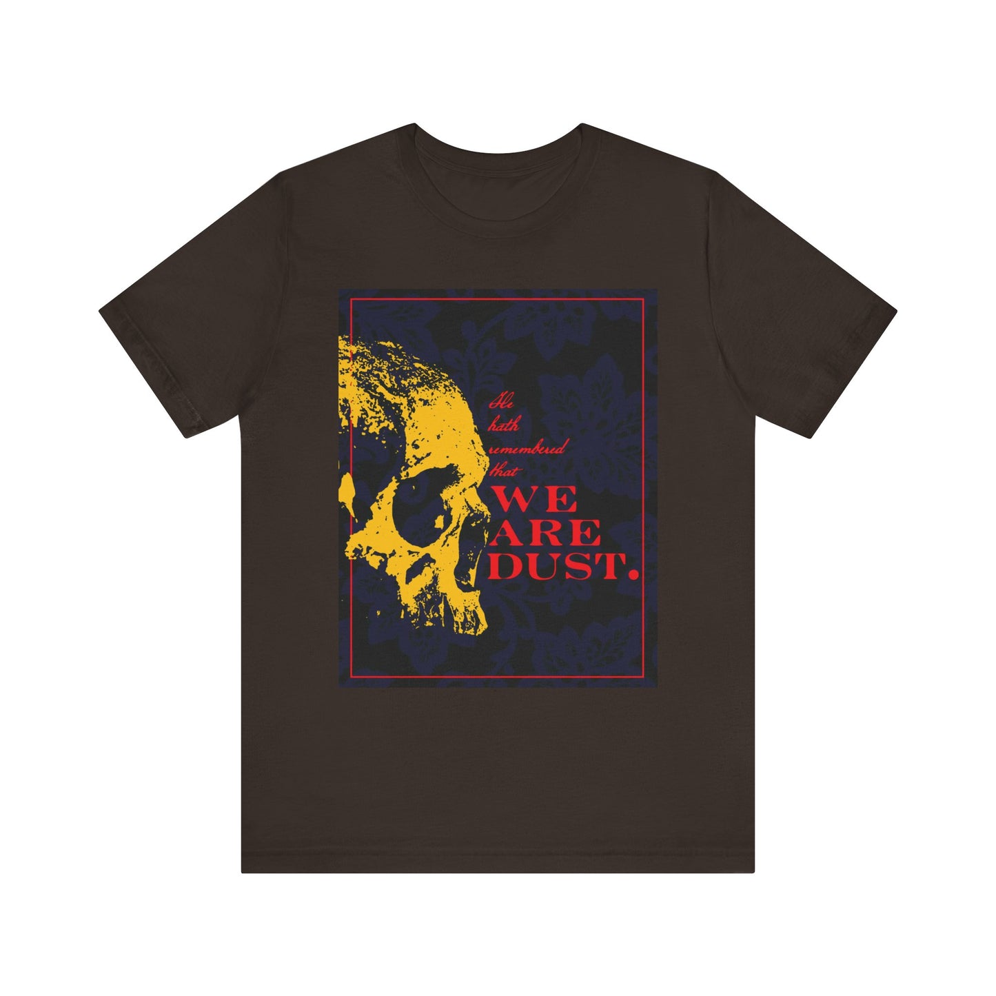 Brown unisex cotton t-shirt featuring a yellow skull over a blue floral background and red "We Are Dust" text—a Memento Mori design inspired by Psalm 102 LXX. Gothic style; product: We Are Dust | Psalms tee.
