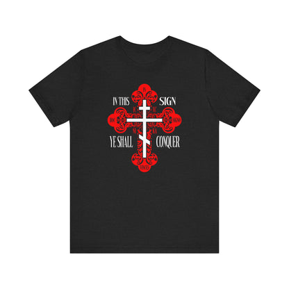 Solid Black Blend unisex tee featuring an ornate Orthodox cross with the phrase “In This Sign Ye Shall Conquer.” Inspired by faith and spiritual warfare. Product: In Hoc Signo Vinces | ICXC NIKA | Jesus Christ Conquers.