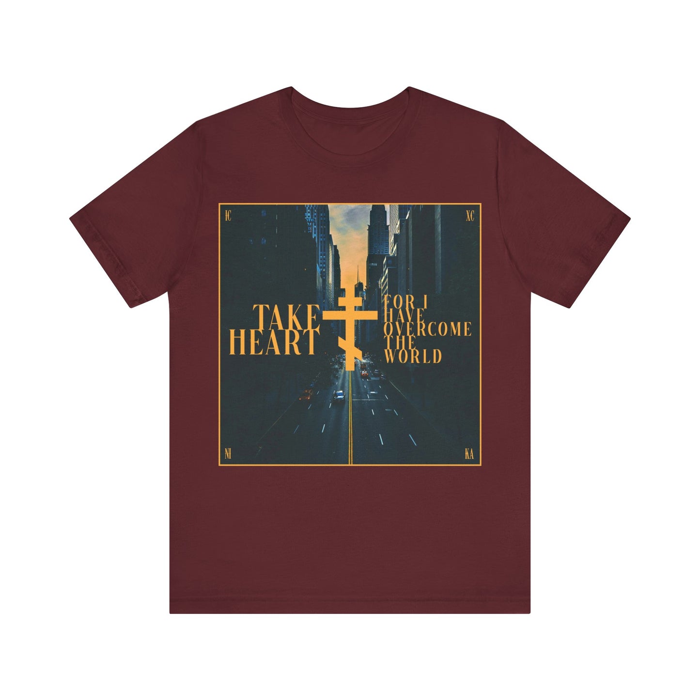 Maroon “Take Heart, For I Have Overcome the World” (John 16:33) Orthodox Christian cotton t-shirt features a modern city street scene design, reminding you that joy can come from sorrow.