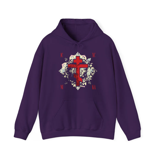 The ICXC NIKA Means Jesus Christ Conquers hoodie features a textured red Orthodox cross with a medieval floral background on purple—a tribute to faith and Orthodox tradition.