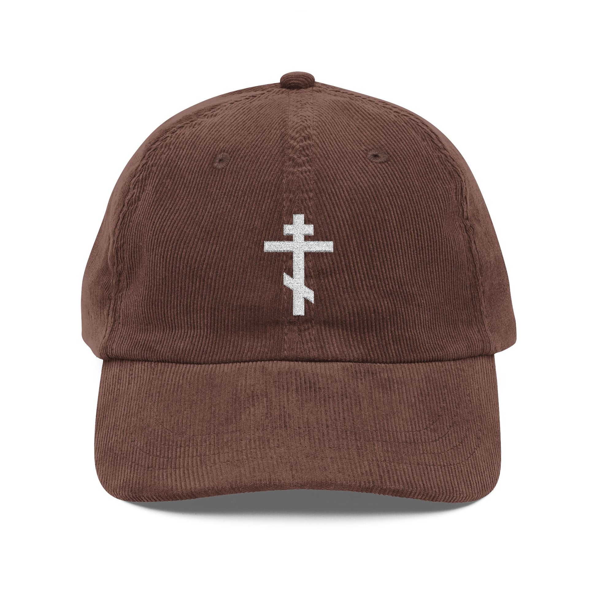Brown cotton corduroy cap featuring a simple white Orthodox TriBar Cross, the weapon of unseen warfare which makes demons tremble. Orthodox Christian embroidered design.