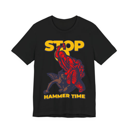 The St Marina of Antioch Beating the Devil with a Hammer tee features "STOP HAMMER TIME" text and bold graphics in red, blue, and yellow—a modern Orthodox meme on a Christian unisex shirt.