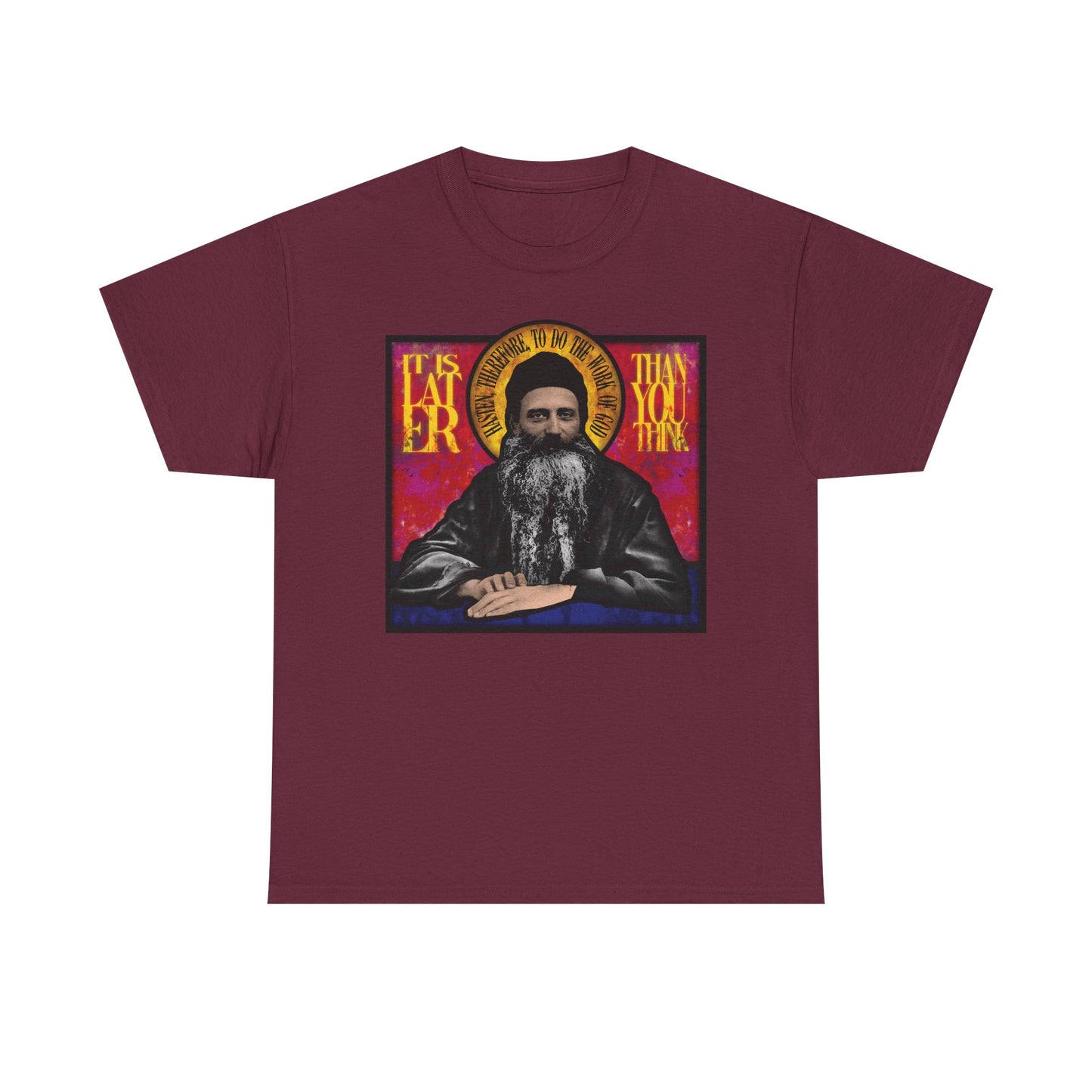 Maroon "It Is Later Than You Think" unisex t-shirt featuring a stained glass-style illustration of Fr. Seraphim Rose—an American Orthodox monastic saint—with a halo and reflective text, inviting contemplation on salvation and the Kingdom of Heaven; crafted from midweight cotton.