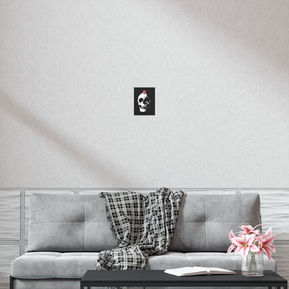 A "You Will Be Here Maps Marker on Skull" art poster—Orthodox Christian Memento Mori—hangs above a gray sofa, with a plaid throw, flowers, and an open book adding cozy touches.