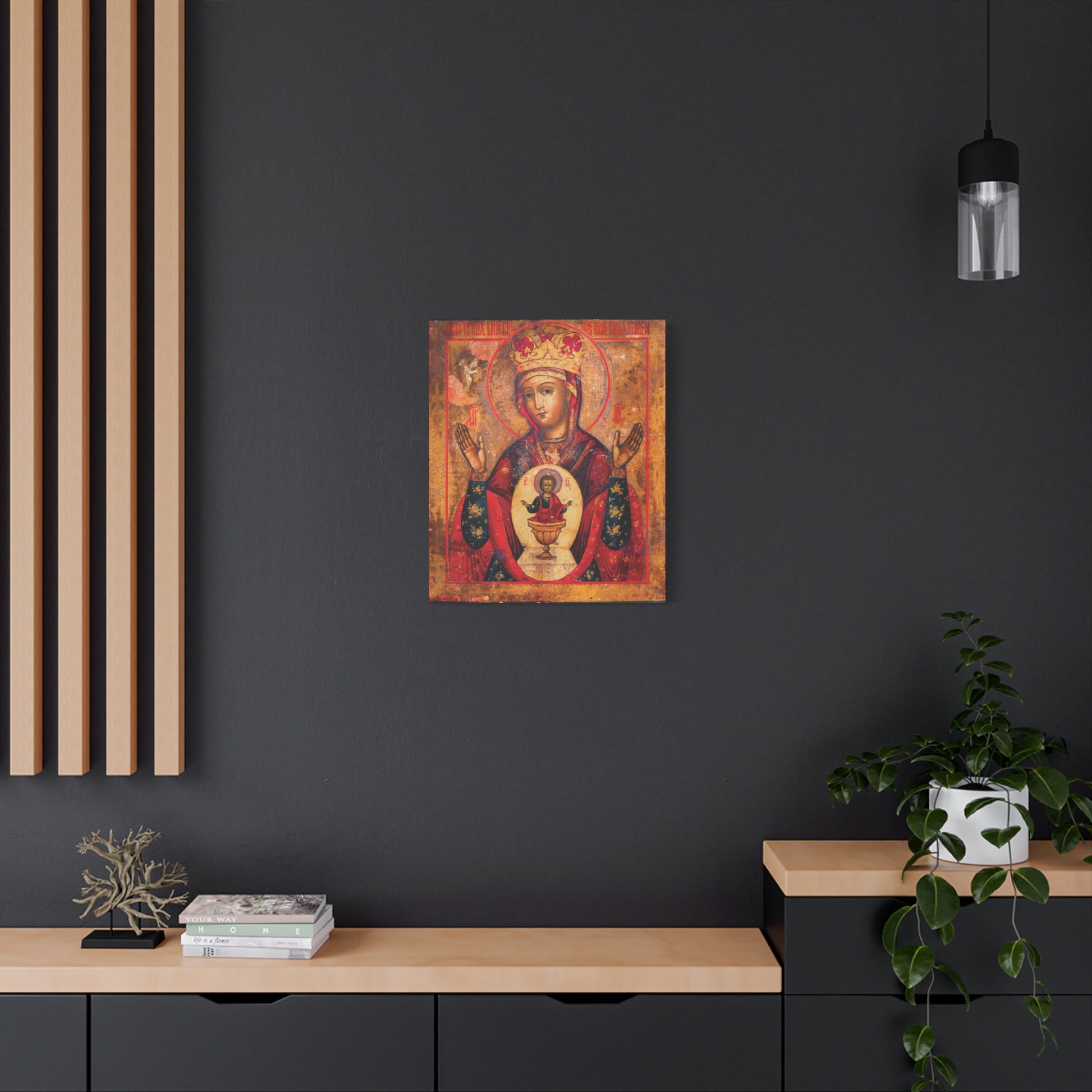 Mother of God of Nicaea Russian Orthodox Christian Icon | Panagia | Theotokos Mary | Religious Canvas Sacred Wall Art hanging on a dark wall above a modern wooden desk decorated with a plant and books.