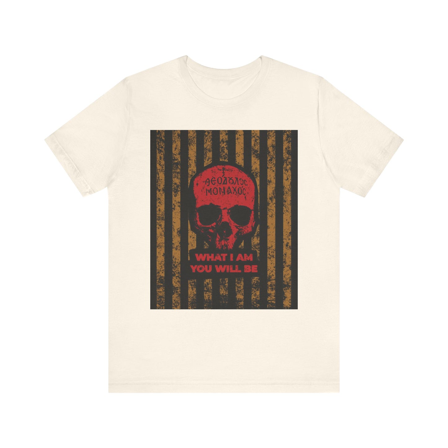 Natural cotton unisex t-shirt featuring a striking Mt Athos monk skull with red detailing, Greek text, and the phrase “WHAT I AM YOU WILL BE” on a bold black and brown striped background—drawing inspiration from the ascetic ethos of memento mori and the teachings of St. Ignatius Brianchaninov.