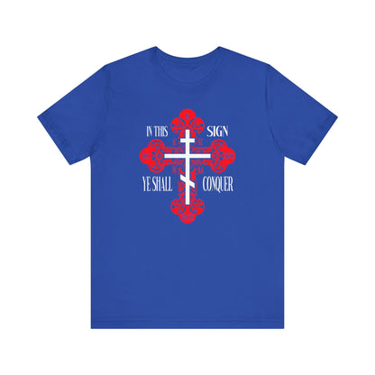 Show your faith with the "In This Sign Ye Shall Conquer" unisex tee in True Royal, featuring an ornate Orthodox Cross and "ICXC NIKA"—ideal for those inspired by Christian victory and spiritual strength.