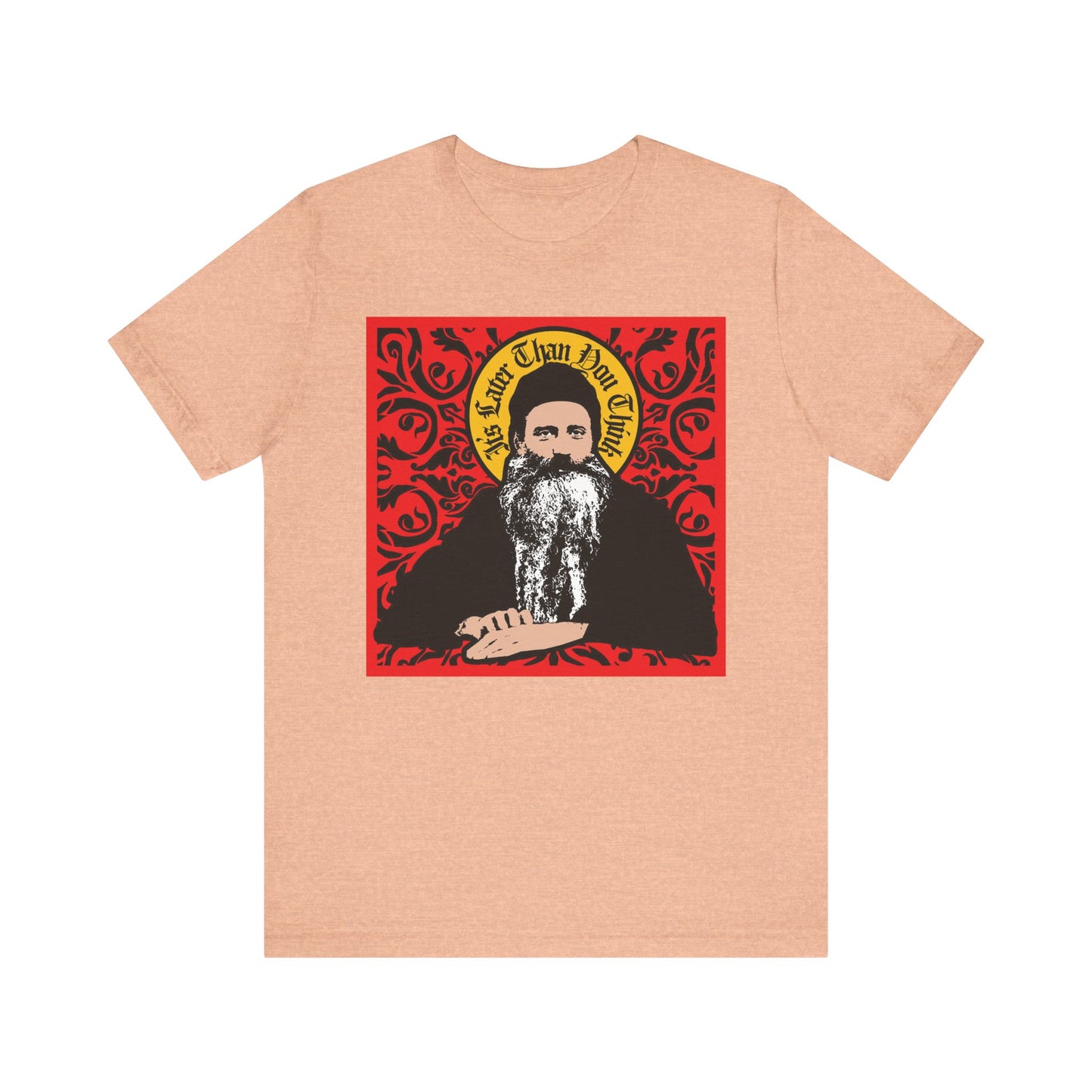 Heather Peach unisex tee featuring Saint Seraphim Rose in icono-graphic style with “It’s Later Than You Think” on a red ornate background—ideal for Orthodox Christians and fans of Religion of the Future. Lightweight cotton.