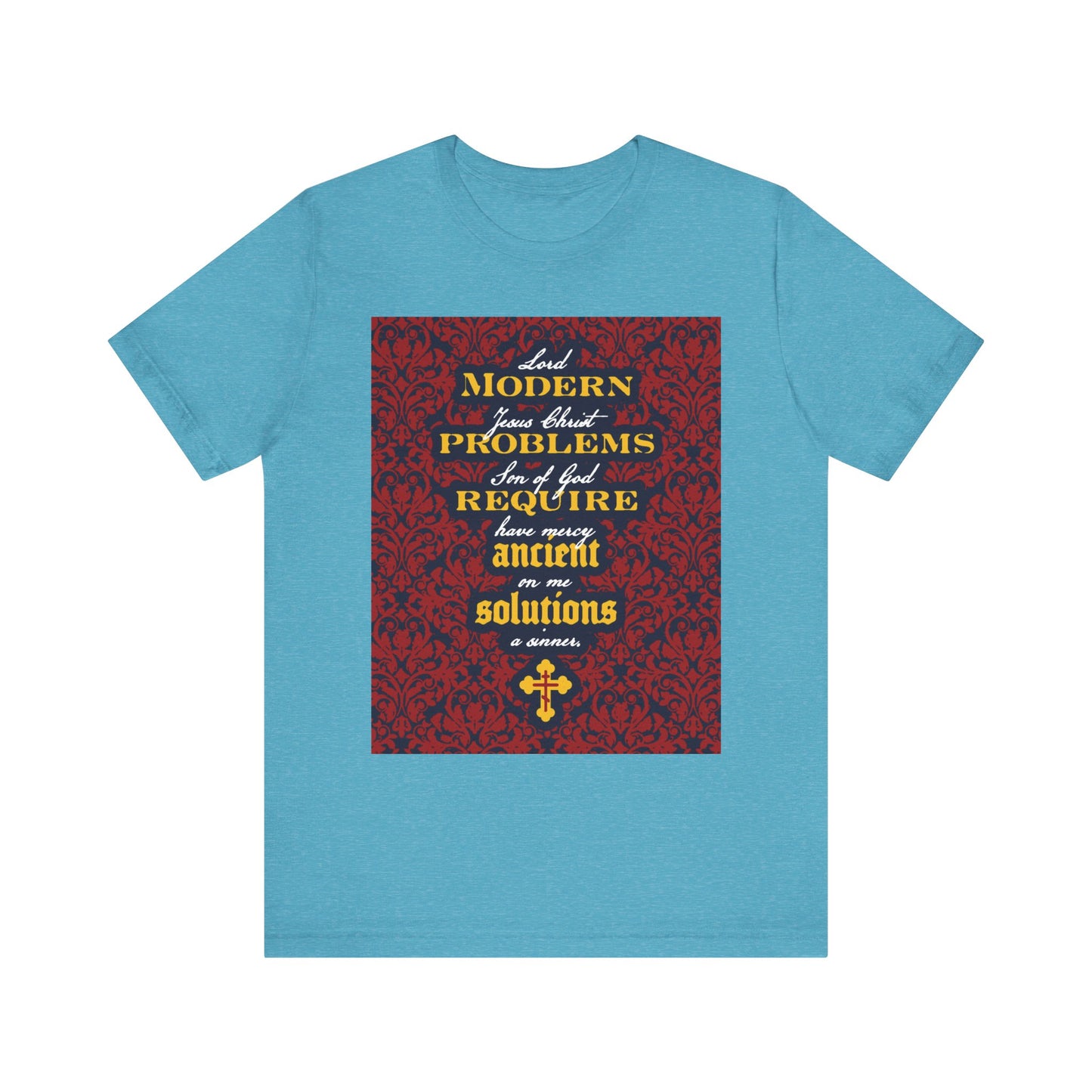 Heather aqua t-shirt featuring an ornate red and gold text design that reads "Modern Problems Require Ancient Solutions," with a floral background, inspired by the enduring power of prayer and faith in Jesus Christ.