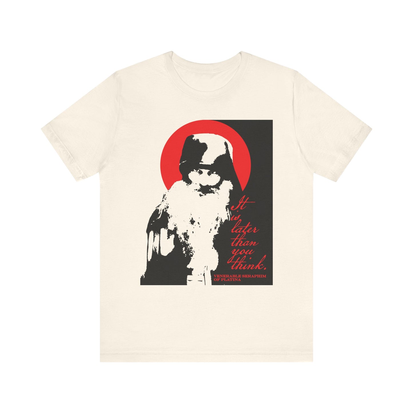 This lightweight cotton unisex t-shirt in natural features a high-contrast black-and-white depiction of Fr Seraphim Rose with a striking red halo, inspired by Orthodox spiritual themes and the memento mori message: "It is later than you think.