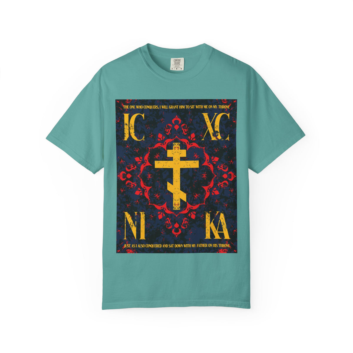 Seafoam heavyweight cotton unisex T-shirt featuring the IC XC NIKA Orthodox cross with Greek letters, accented by a medieval floral red and blue ornate design—symbolizing the grace of God in our journey toward salvation, inspired by “The One Who Conquers” (Revelation 3:21).