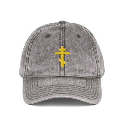 Charcoal grey distressed cap with a minimalist yellow Orthodox TriBar cross, symbolizing salvation, embroidered on the front. From the Simple Yellow Orthodox TriBar Cross collection. Front view shown.
