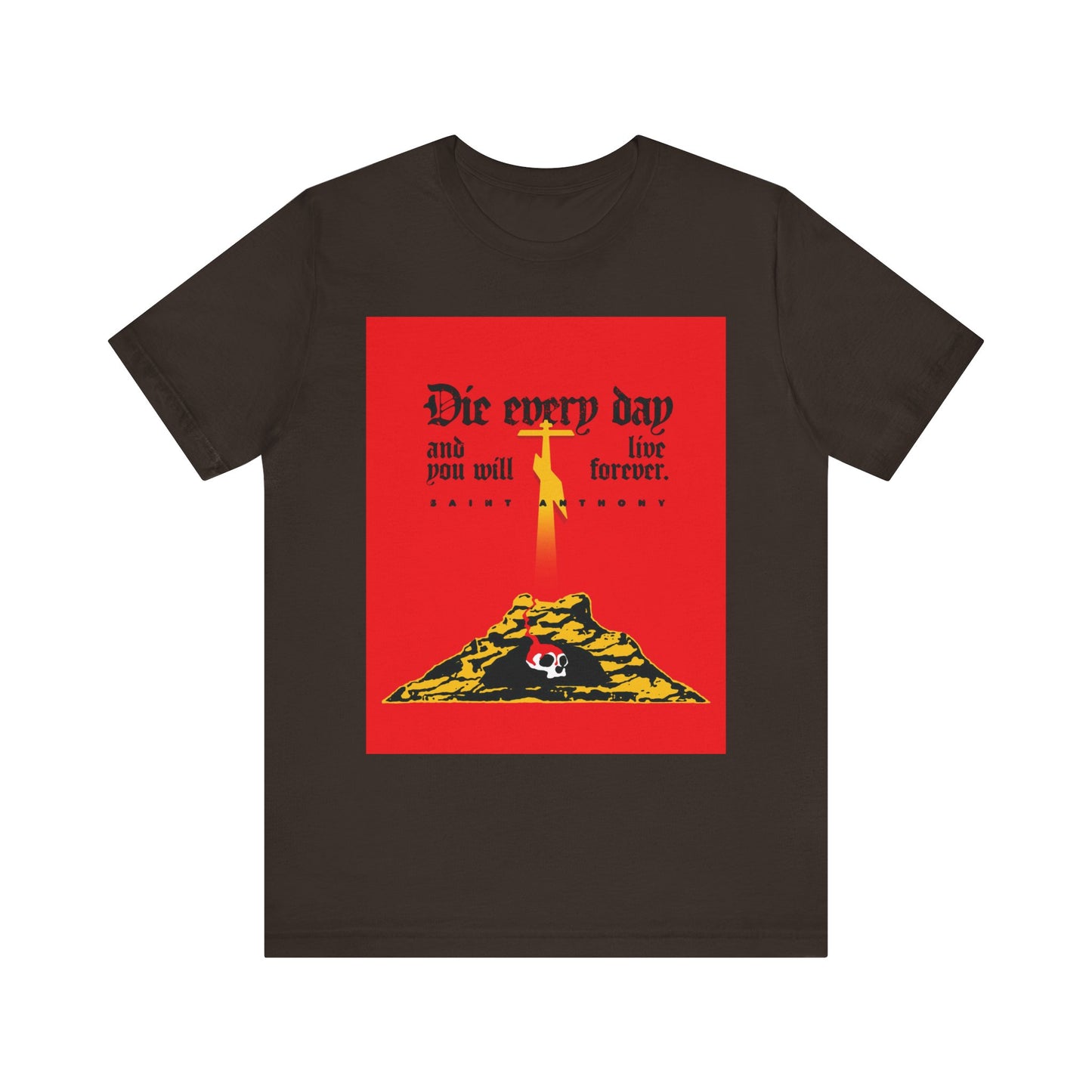 Brown lightweight cotton unisex tee featuring a red Golgotha Cross and Skull of Adam design with the text “Die Every Day and You Will Live Forever,” inspired by St Anthony the Great’s message on seeking eternal life.