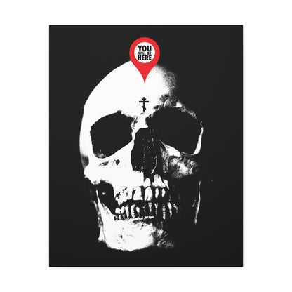 The "You Will Be Here Maps Marker on Skull Design" canvas art features a red marker reading "You are here" above a white skull on black, echoing Orthodox Christian Memento Mori and St. Ignatius Brianchaninov’s teachings on death remembrance.