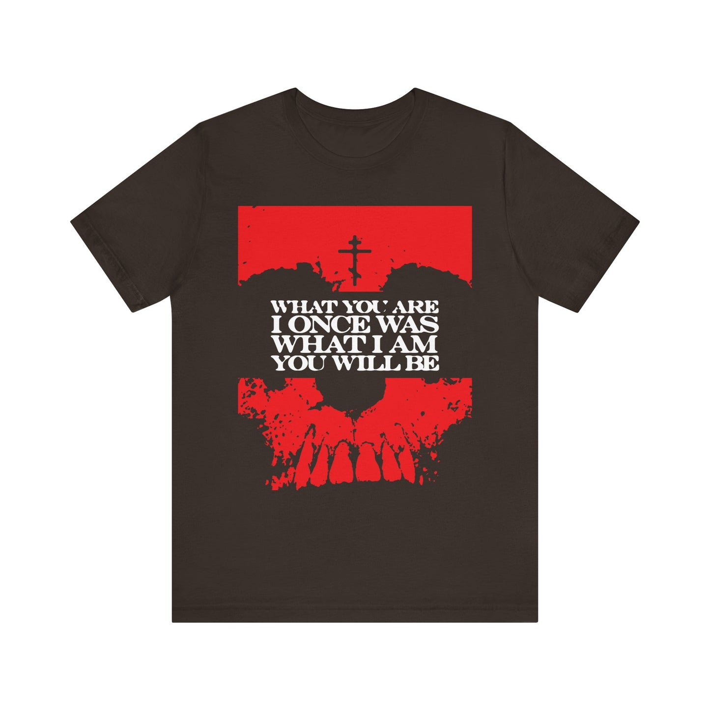 Brown t-shirt featuring a striking red skull graphic, a cross, and white text that reads WHAT YOU ARE I ONCE WAS WHAT I AM YOU WILL BE—a bold Memento Mori design that reflects on mortality while subtly invoking the hope of Christian salvation.