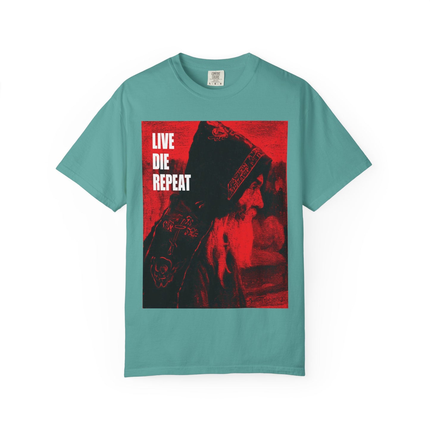 Seafoam heavyweight cotton tee featuring Mikhail Nesterov’s Orthodox monk art and “LIVE DIE REPEAT” in bold white—echoing St. Antony the Great’s “Die Every Day, You Will Live Forever” ascetic wisdom.