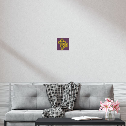 The "Every Knee Shall Bow" Orthodox Christian art poster, with a 70s distressed comic book style, hangs above a gray couch with a plaid throw, creating a peaceful setting completed by a coffee table topped with flowers and an open book.