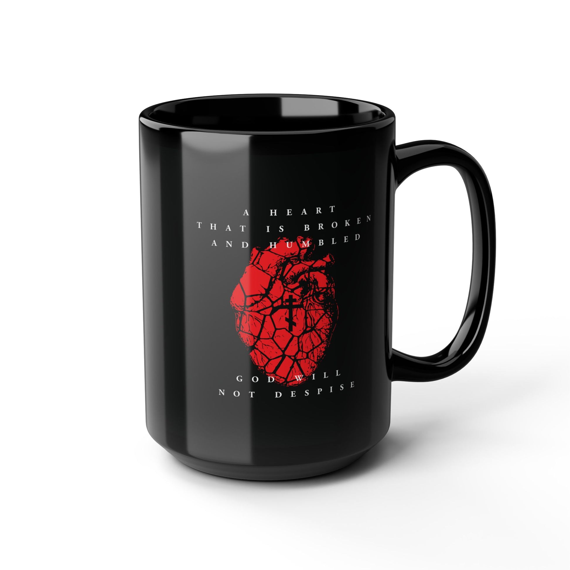 The “A Heart That is Broken and Humbled God Will Not Despise” black mug features a cracked red heart with an Orthodox cross, inspired by Psalm 51—a daily reminder of repentance and a humble spirit.