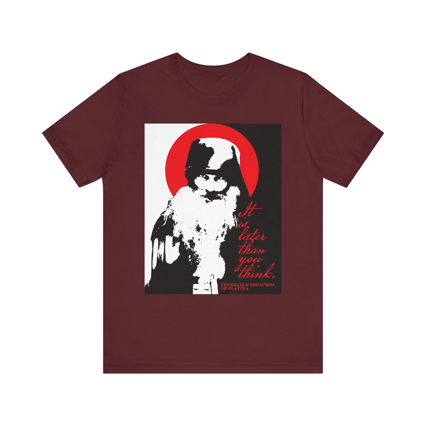Introducing the "It's Later Than You Think" unisex t-shirt in maroon—a lightweight cotton tee featuring a striking high-contrast black, white, and red design with an image of Fr Seraphim Rose, set within a vivid red circle. The graphic and memento mori message serve as an evocative nod to Orthodox spiritual life and the urgency of spiritual discipline.