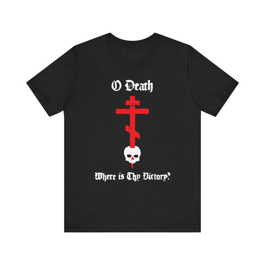 Black Orthodox unisex tee featuring a red cross stabbing a white skull, spraypaint aesthetic, and "O Death Where is Thy Victory? 1 Cor 15:55" in gothic font. Lightweight cotton.
