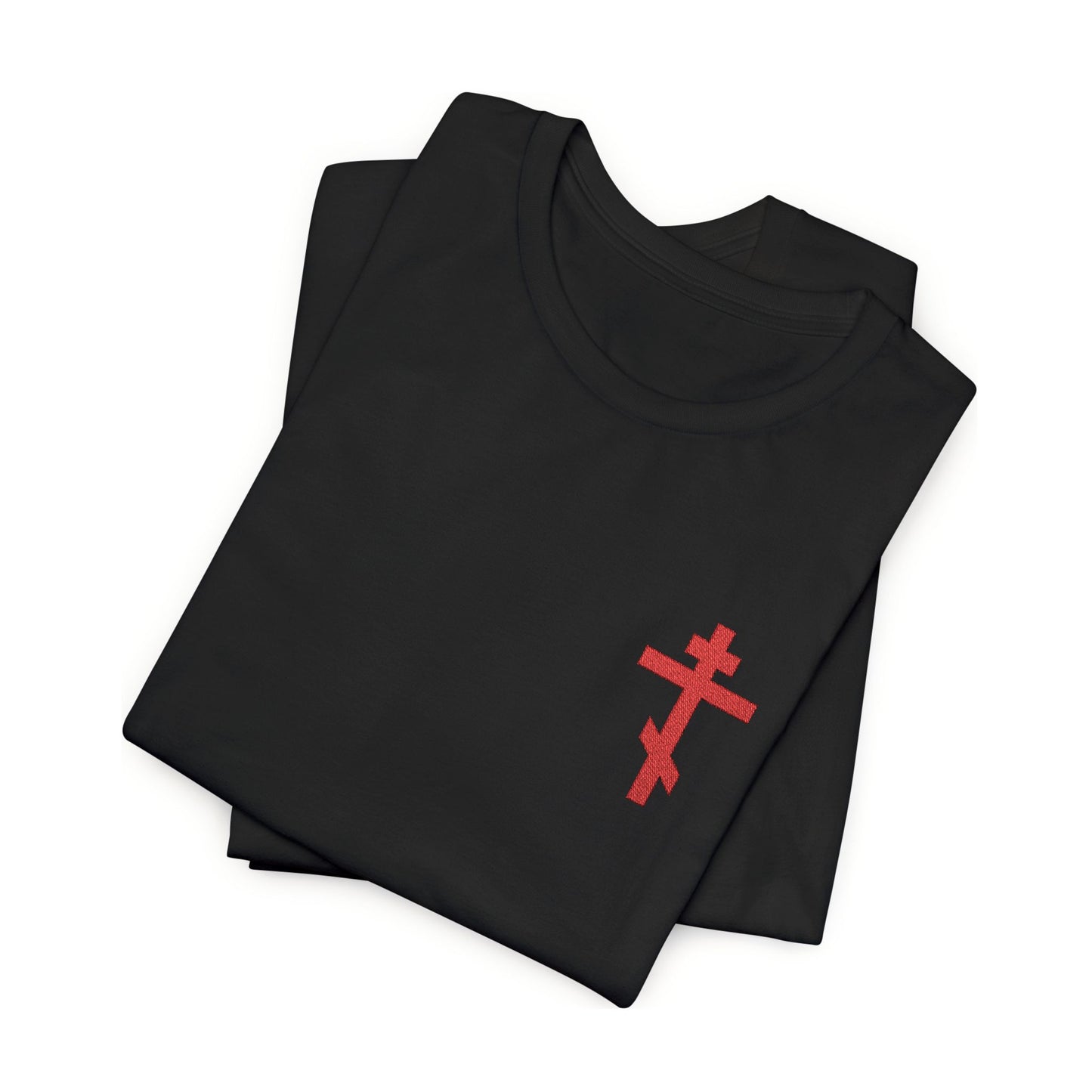 Two folded black unisex cotton t-shirts feature a small red embroidered Orthodox cross on the chest, inspired by Galatians 6:14: "May I Never Boast Except in the Cross.