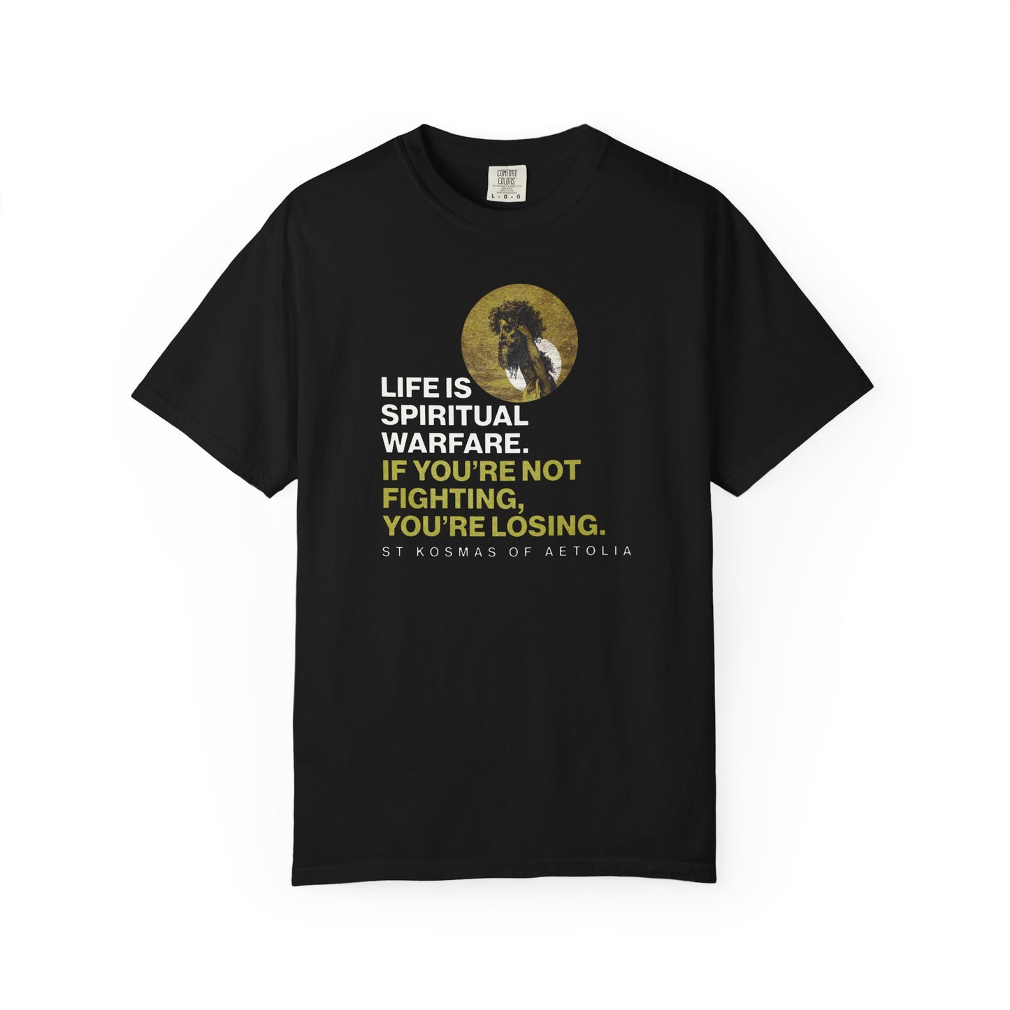 Black heavyweight cotton tee featuring St. Kosmas of Aetolia with the quote: "Life is spiritual warfare. If you're not fighting, you're losing." Artwork inspired by Gustave Dore’s David & Goliath. Orthodox unisex fit.