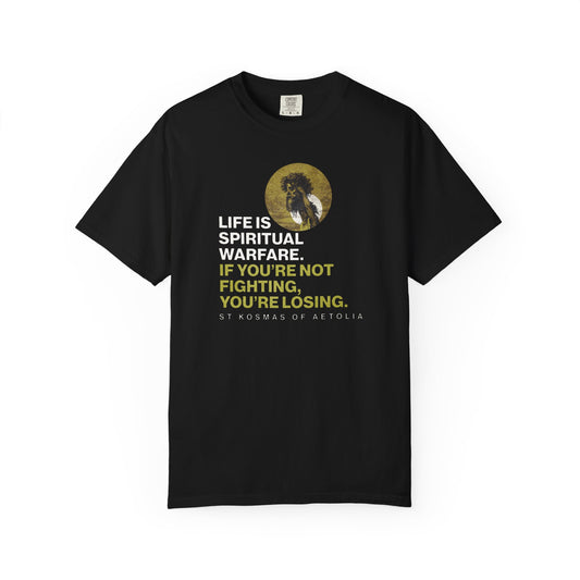 Black heavyweight cotton tee featuring St. Kosmas of Aetolia with the quote: "Life is spiritual warfare. If you're not fighting, you're losing." Artwork inspired by Gustave Dore’s David & Goliath. Orthodox unisex fit.