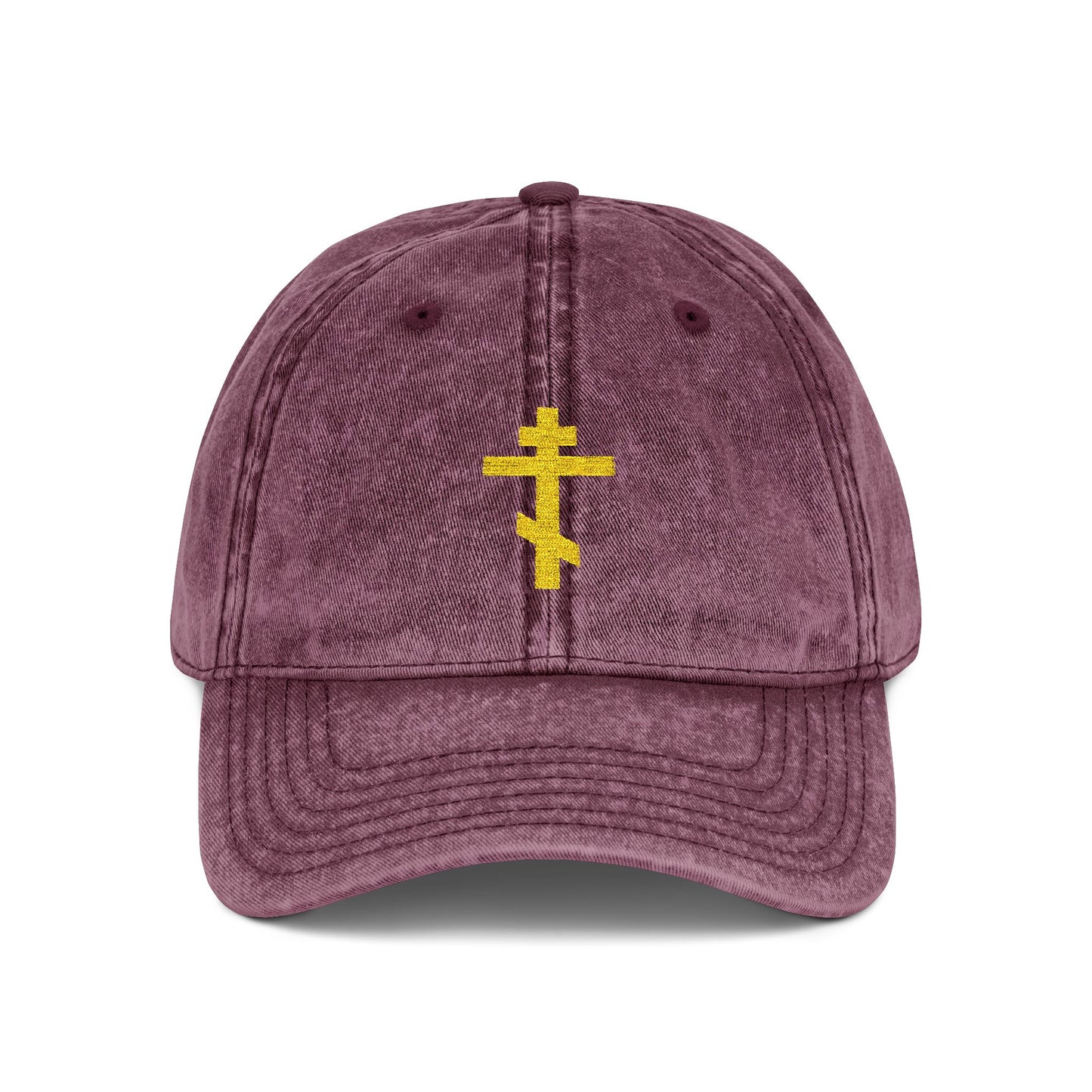 Maroon cap featuring a minimalist yellow Orthodox TriBar Cross and "Crucify My Ego to the Precious and Life Giving Cross" embroidery, symbolizing Christian faith.