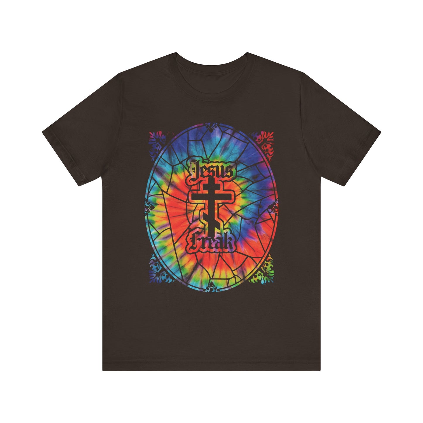 Brown lightweight cotton unisex tee featuring a tie-dyed stained glass window design with a bold "Jesus Freak" text and an Orthodox cross at the center, inspired by the 70s Jesus Movement hippie spirit and honoring the legacy of Duane Pederson.