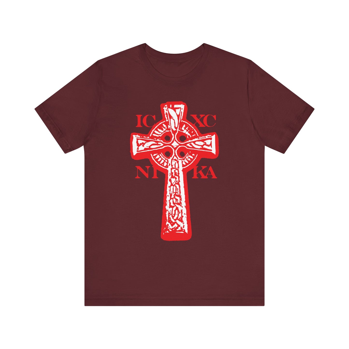 Maroon T-shirt featuring a bold black and white Celtic Knotwork Cross with the inscription "ICXC NIKA" (Jesus Christ Conquers) on a red background, symbolizing the profound power of the Crucified. Made from lightweight cotton in a unisex fit.