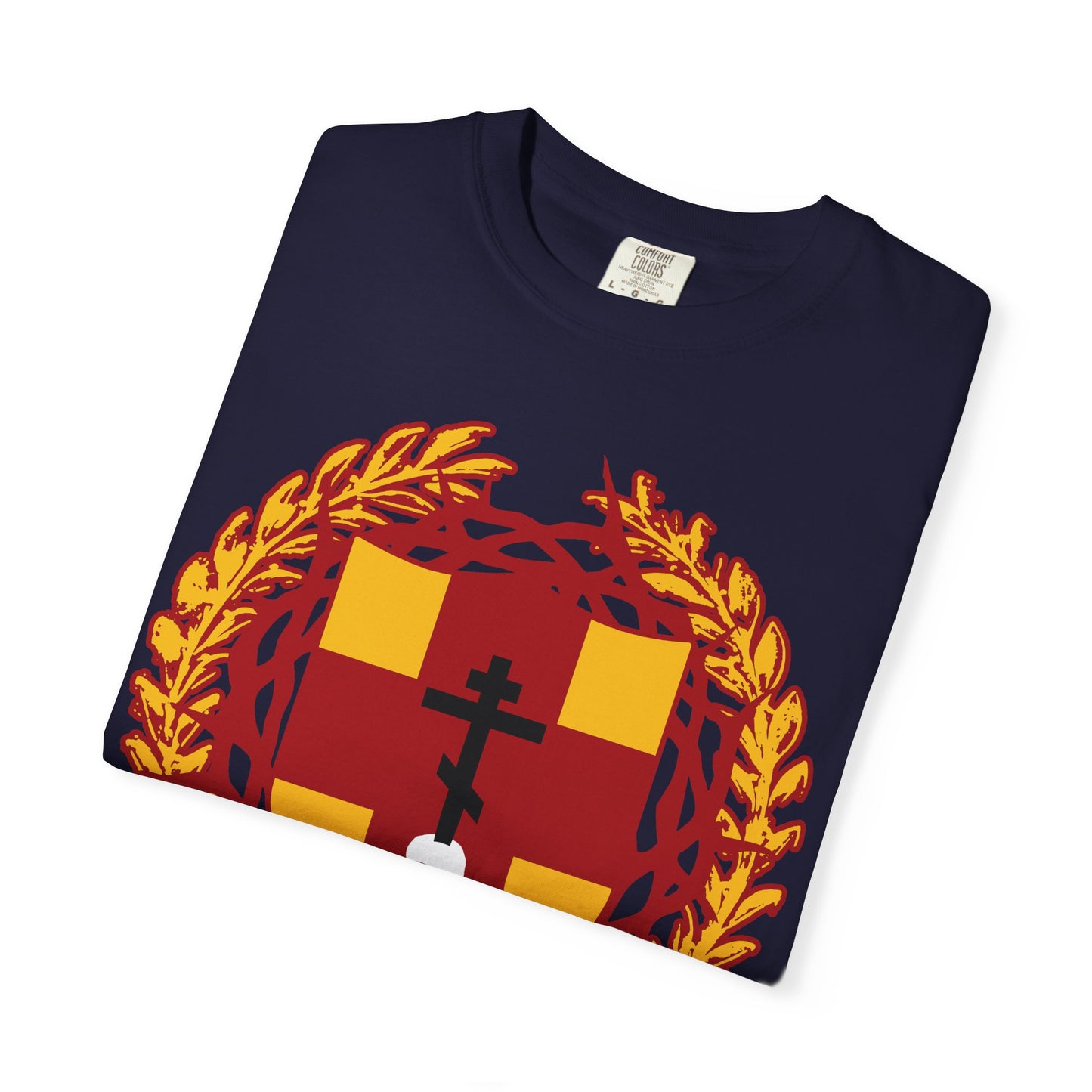 Navy blue heavyweight cotton unisex t-shirt featuring a heraldic shield design with an Orthodox cross stabbing a skull, crowned with thorns, inspired by “First-Born from the Dead” (Col 1:18), and symbolizing redemption through His blood.